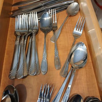 Assortment of flatware that doesn't all match - forks - spoons - butter knives - serving utensils 50 +
