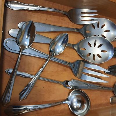 Assortment of flatware that doesn't all match - forks - spoons - butter knives - serving utensils 50 +