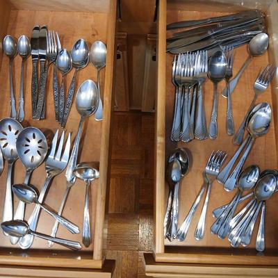 Assortment of flatware that doesn't all match - forks - spoons - butter knives - serving utensils 50 +