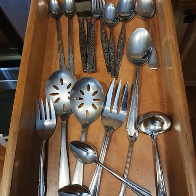 Assortment of flatware that doesn't all match - forks - spoons - butter knives - serving utensils 50 +