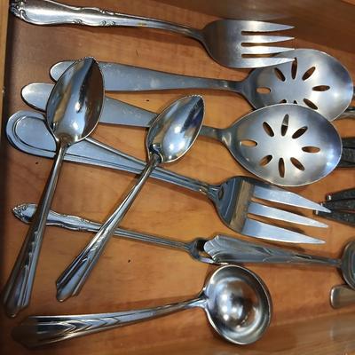 Assortment of flatware that doesn't all match - forks - spoons - butter knives - serving utensils 50 +