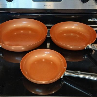 Three Copper Chef frying pans 8, 10, and 12" pans with electric burner