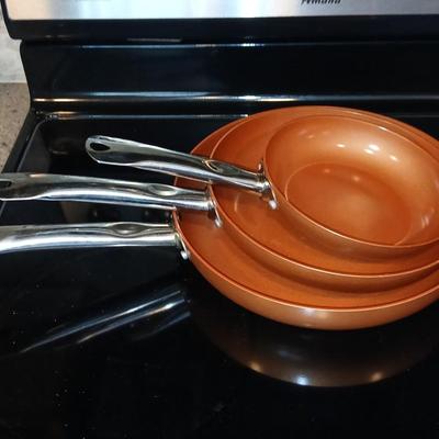 Three Copper Chef frying pans 8, 10, and 12" pans with electric burner