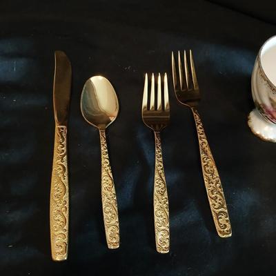Two dainty teacups with salt & pepper and gold toned Americana Golden Heritage flatware