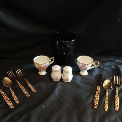 Two dainty teacups with salt & pepper and gold toned Americana Golden Heritage flatware