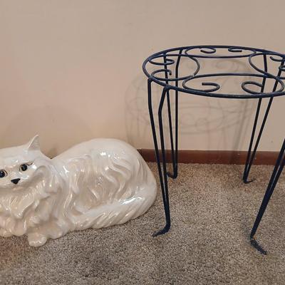 Large ceramic cat with a metal plant stand