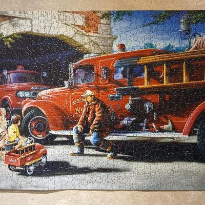 Completed Fireman puzzle with Dalmation salt & pepper shakers with a wooden shelf and picture frame