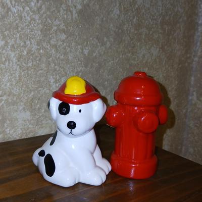 Completed Fireman puzzle with Dalmation salt & pepper shakers with a wooden shelf and picture frame