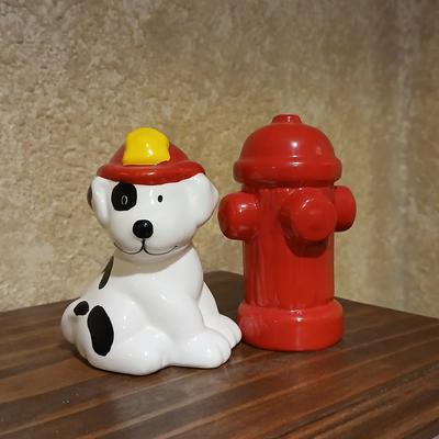 Completed Fireman puzzle with Dalmation salt & pepper shakers with a wooden shelf and picture frame
