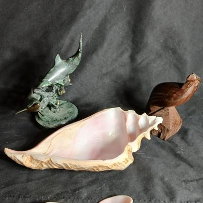 Seashell dish with spoon, dancing dolphins and a wooden Eagle