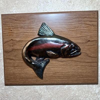 Two brass fish on wood wall art