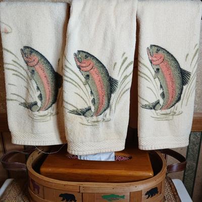 Three Rainbow trout hand towels and a basket with bear and fish on it
