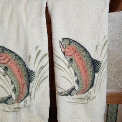 Three Rainbow trout hand towels and a basket with bear and fish on it