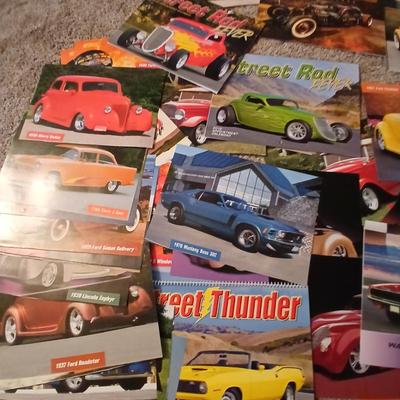 Two framed vintage car wall art one lights up! and a bunch of pictures and calendar photos of hot rods