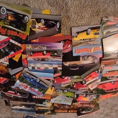 Two framed vintage car wall art one lights up! and a bunch of pictures and calendar photos of hot rods