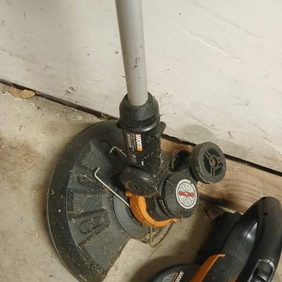 Worx 20-volt battery operated weed eater and leaf blower with 4 batteries and 1 charger