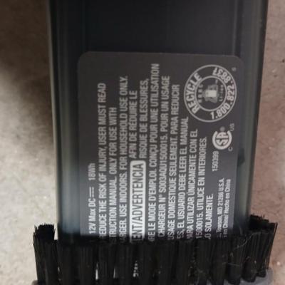Handheld vacuum with battery and charger