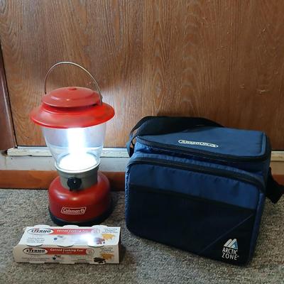 Soft sided cooler with cans of sterno and a Coleman battery operate