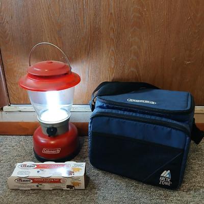 Soft sided cooler with cans of sterno and a Coleman battery operate