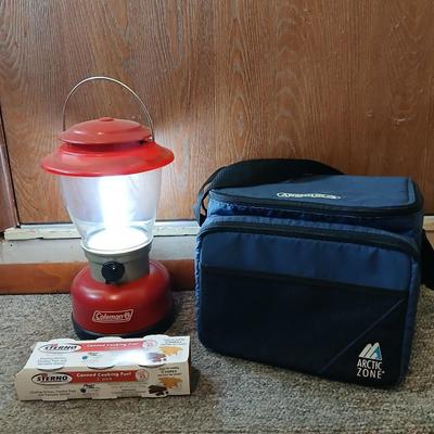 Soft sided cooler with cans of sterno and a Coleman battery operate