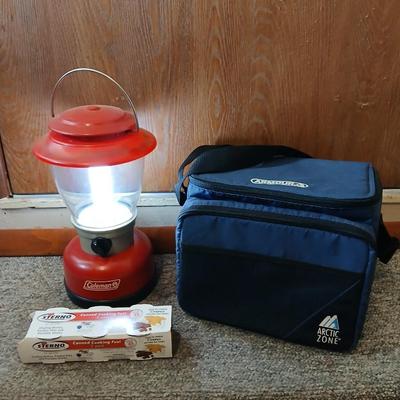 Soft sided cooler with cans of sterno and a Coleman battery operate