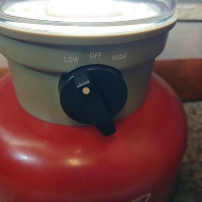 Soft sided cooler with cans of sterno and a Coleman battery operate