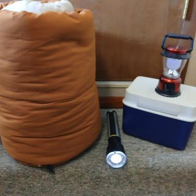 Nice sleeping bag with Stanley tri-pod flashlight and a small cooler
