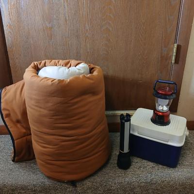 Nice sleeping bag with Stanley tri-pod flashlight and a small cooler