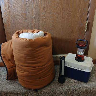 Nice sleeping bag with Stanley tri-pod flashlight and a small cooler