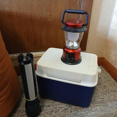 Nice sleeping bag with Stanley tri-pod flashlight and a small cooler