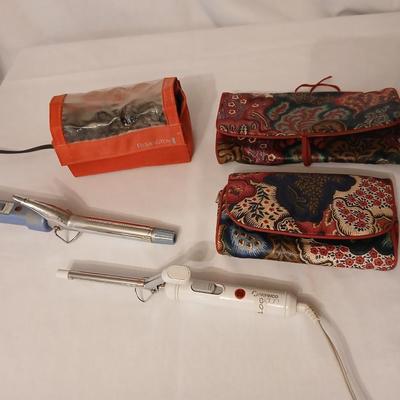 Two curling Irons, make-up travel bags and a set of electric curlers