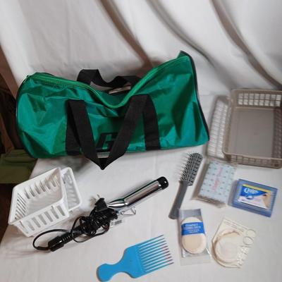 Curling iron, with hair and makeup accessories and a duffle bag with net ends for traveling or leisure