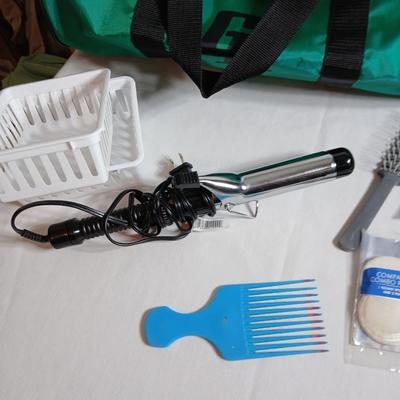Curling iron, with hair and makeup accessories and a duffle bag with net ends for traveling or leisure