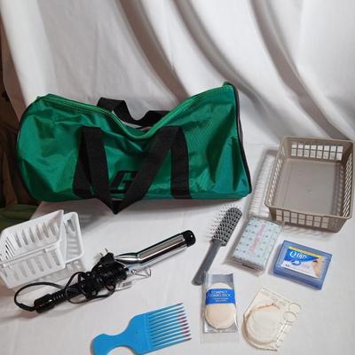 Curling iron, with hair and makeup accessories and a duffle bag with net ends for traveling or leisure