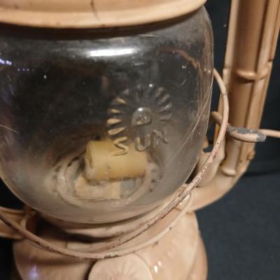 Two vintage kerosene lanterns Elephant 225 and Sun with embossed globe