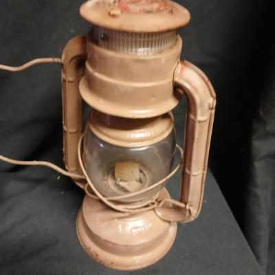 Two vintage kerosene lanterns Elephant 225 and Sun with embossed globe