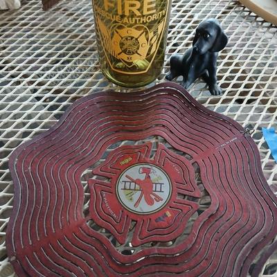 Fire department yard whirl gig with water bottle