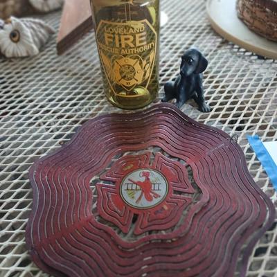 Fire department yard whirl gig with water bottle