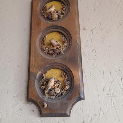 Chalkware Owls and framed wall art with a wooden shelf