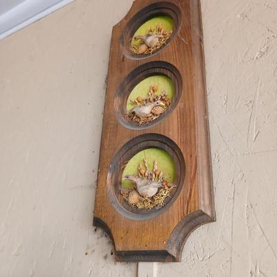 Chalkware Owls and framed wall art with a wooden shelf