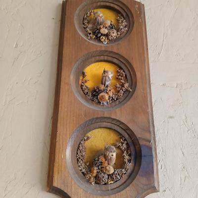 Chalkware Owls and framed wall art with a wooden shelf