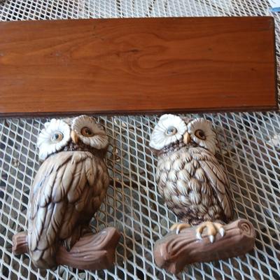 Chalkware Owls and framed wall art with a wooden shelf