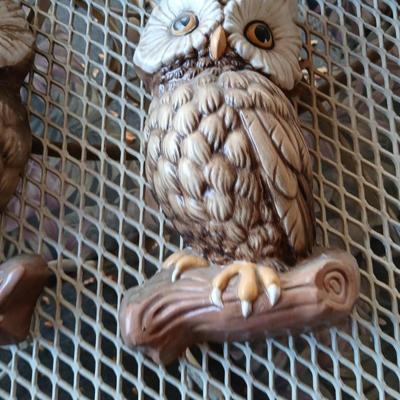 Chalkware Owls and framed wall art with a wooden shelf