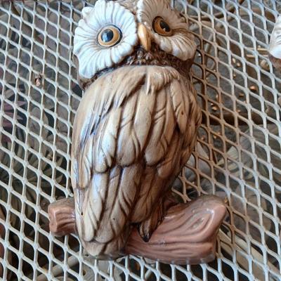 Chalkware Owls and framed wall art with a wooden shelf