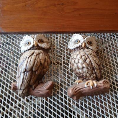 Chalkware Owls and framed wall art with a wooden shelf