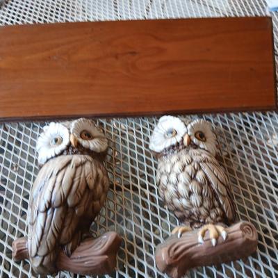 Chalkware Owls and framed wall art with a wooden shelf