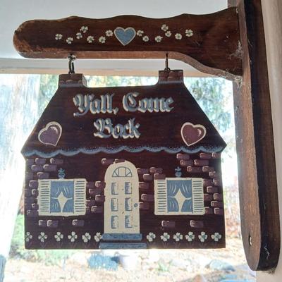 Welcome friends sign with solar powered wind chimes