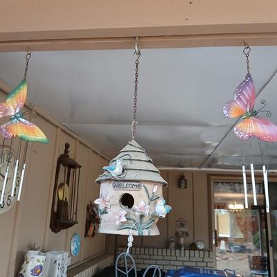 Hanging butterfly chimes and a small bird house