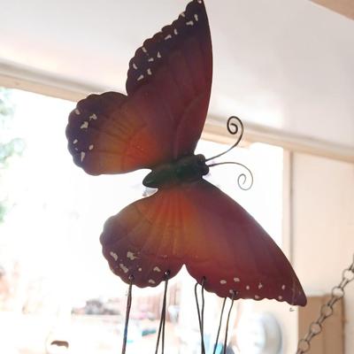 Hanging butterfly chimes and a small bird house