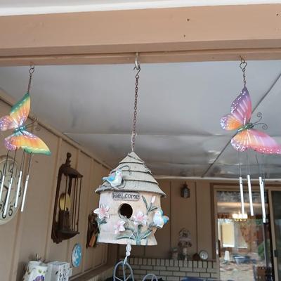 Hanging butterfly chimes and a small bird house